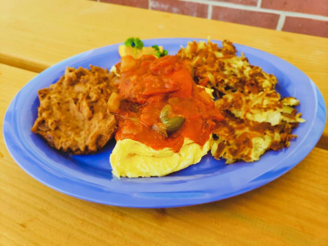 Omelet with salsa and shredded hash browns