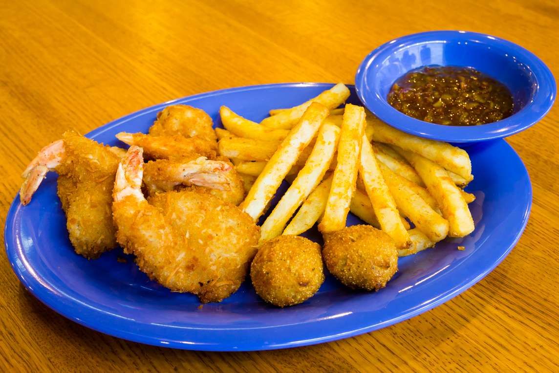 Hand-breaded fried shrimp with fries and cocktail sauce