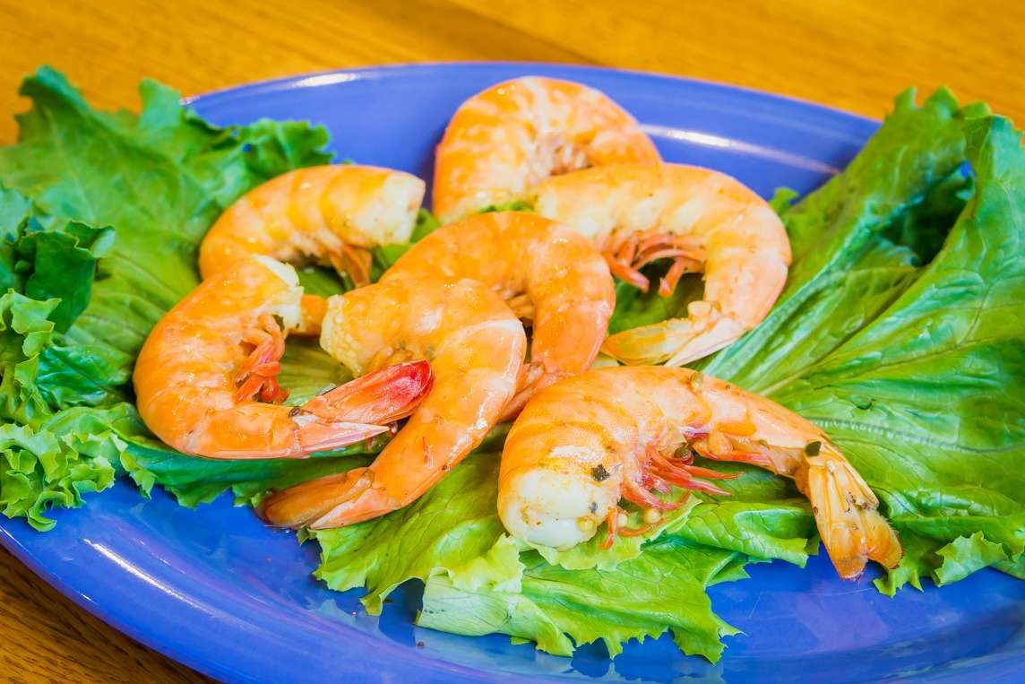 Peel-and-eat boiled shrimp on lettuce