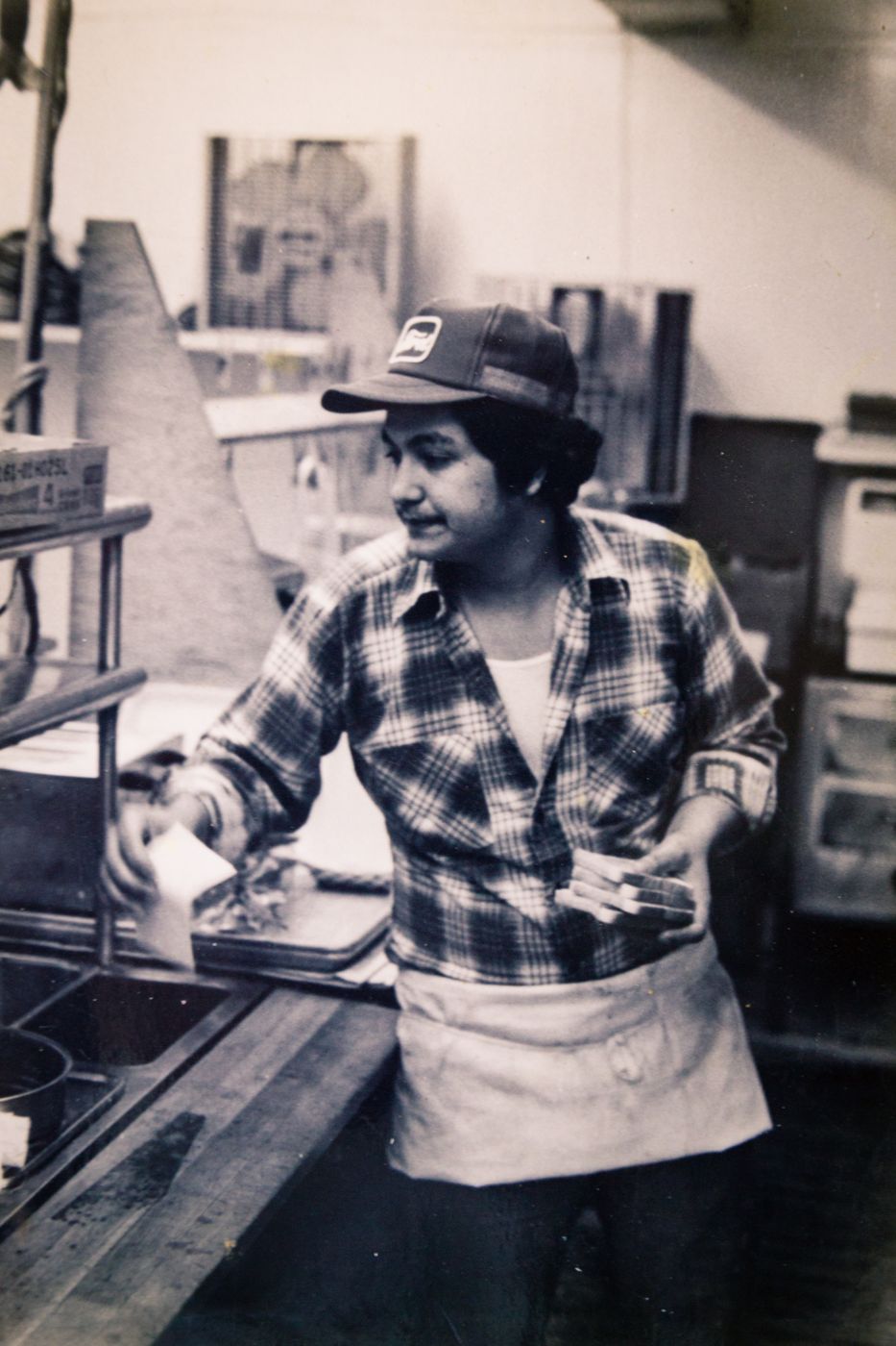 Black and white photo of Big Avery cooking in a restaurant kitchen