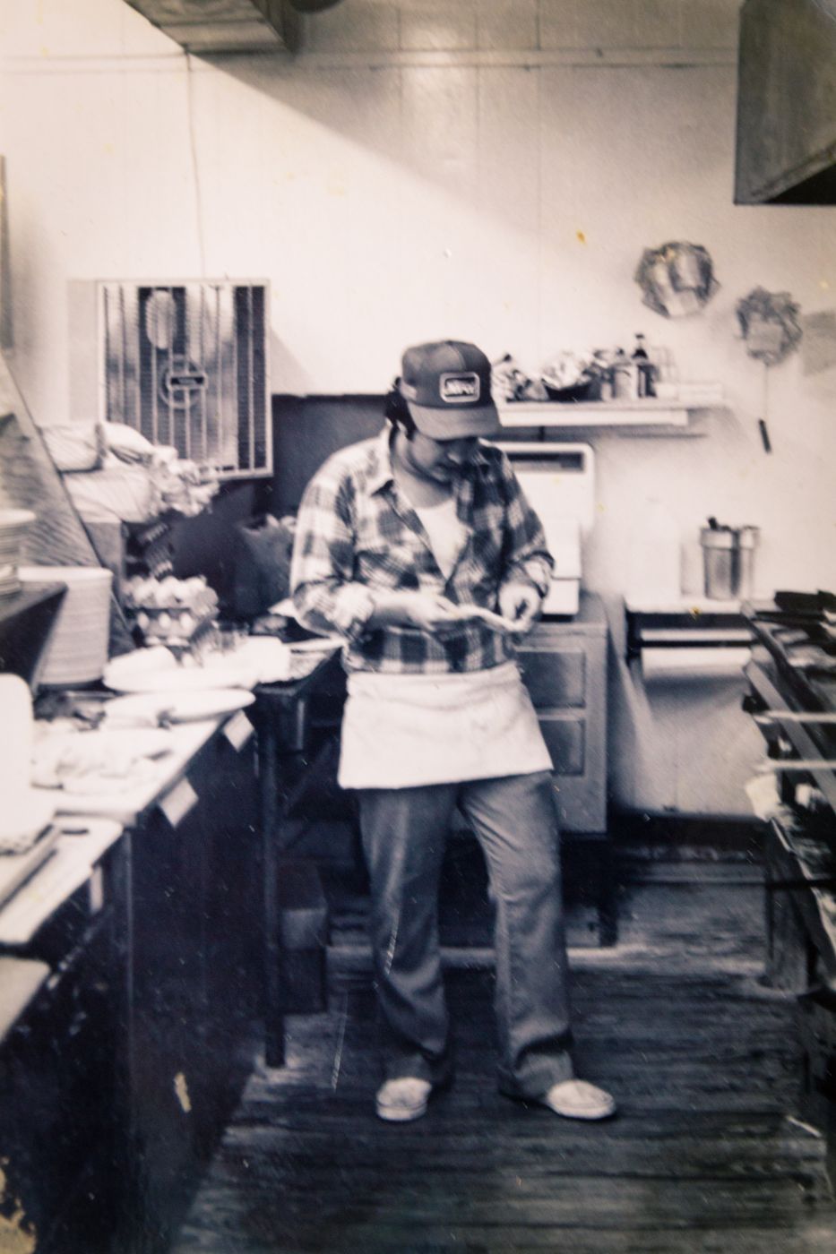 Vintage black and white photo of Big Avery in a restaurant kitchen