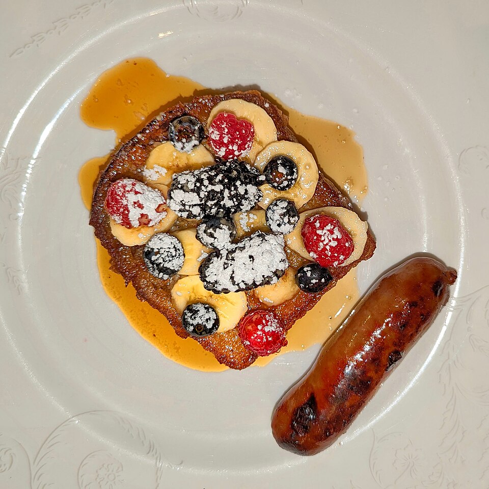 Sample photo: French toast with berries, banana, maple syrup, and sausage - London, UK